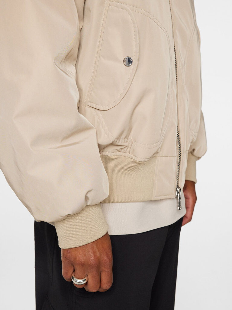 B1679-Bradley-Bomber-Jacket-J-Lindeberg-Moonbeam-Side-Close-Up-Pocket-Sleeve